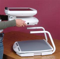 Image of the Journey's easily removed camera head being held above its base.