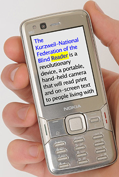 Photograph of a hand holding up the Nokia Mobile Reader