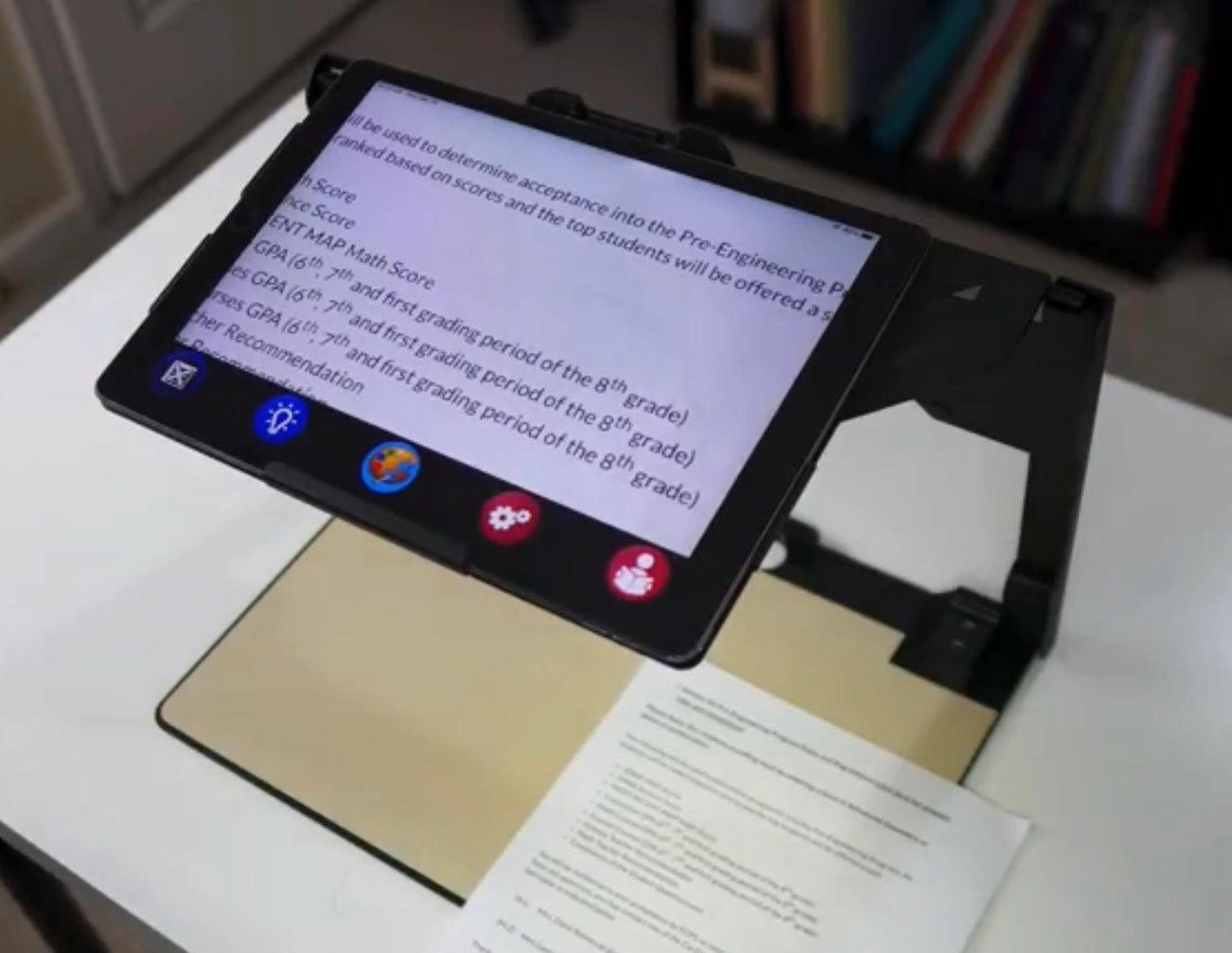 Image is of the Patriot Pro 12.9 on a tabletop with enlarged print material on the screen.